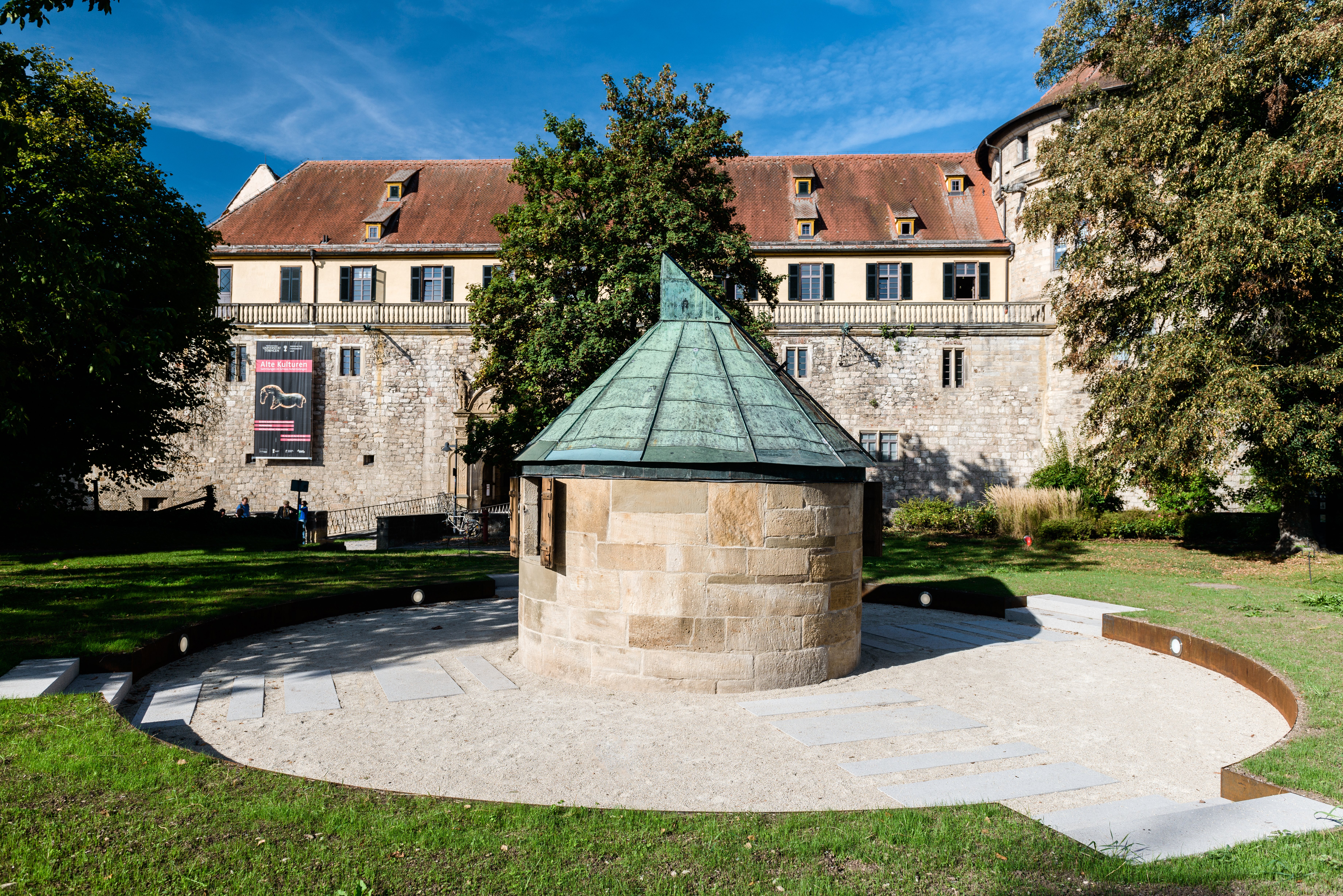 View of the observatory, a small circular building with a copper roof, and Hohentübingen Castle in the background