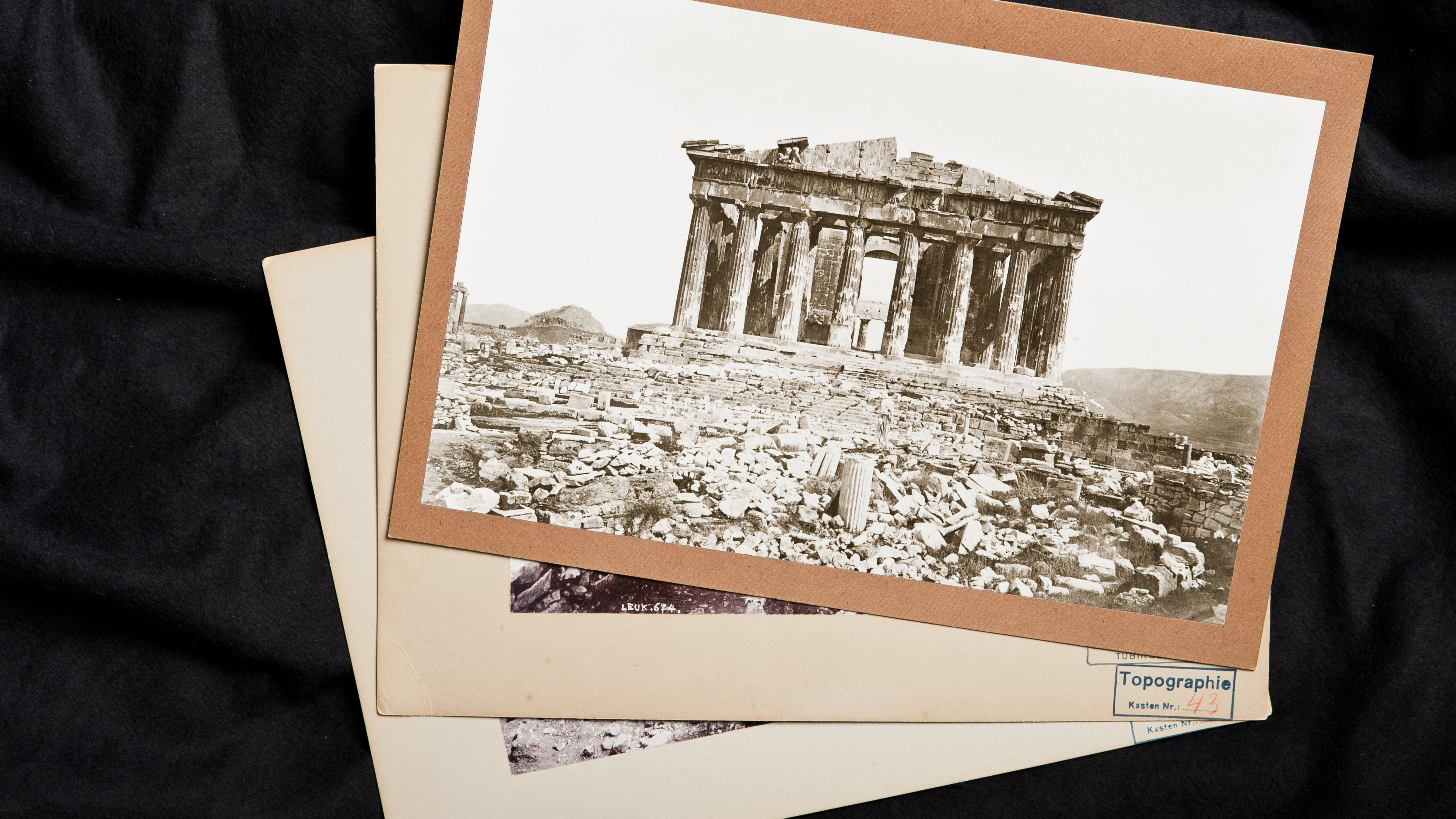 Three vintage photographs on top of each other, with the upmost showing the ruin of a round ancient temple