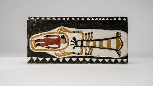 Photo: MUT | Valentin Marquardt Painted plaster cast propped up on its long side, showing a person enclosed by a line which in turn is grabbed by a giant crab