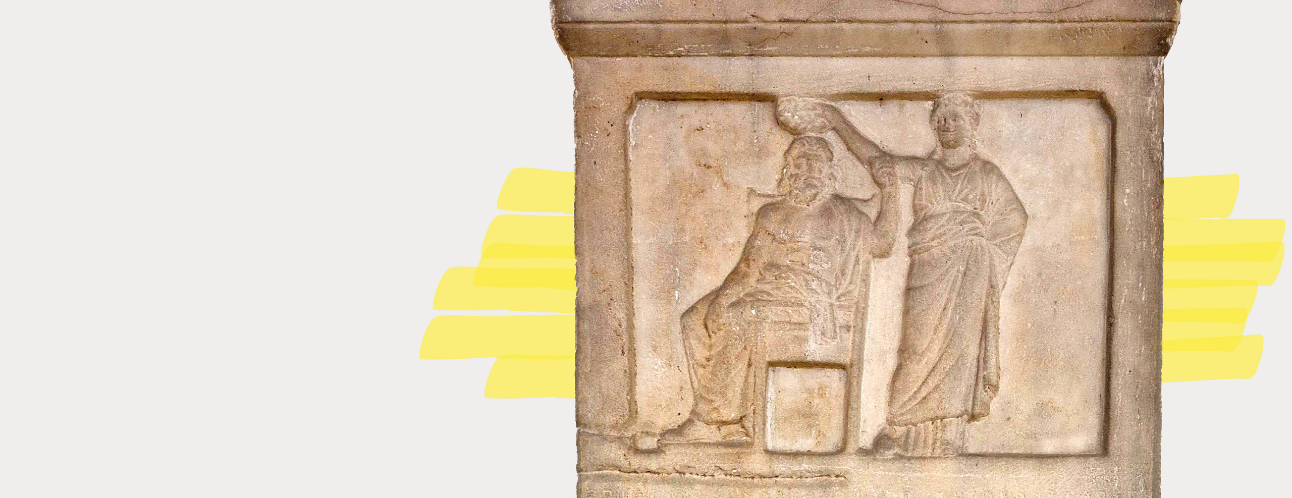 Close-up of a stele with a bas-relief depicting a female figure (Demokratia, right) holding a wreath over the head of a seated male figure (personification of the citizenry, left).