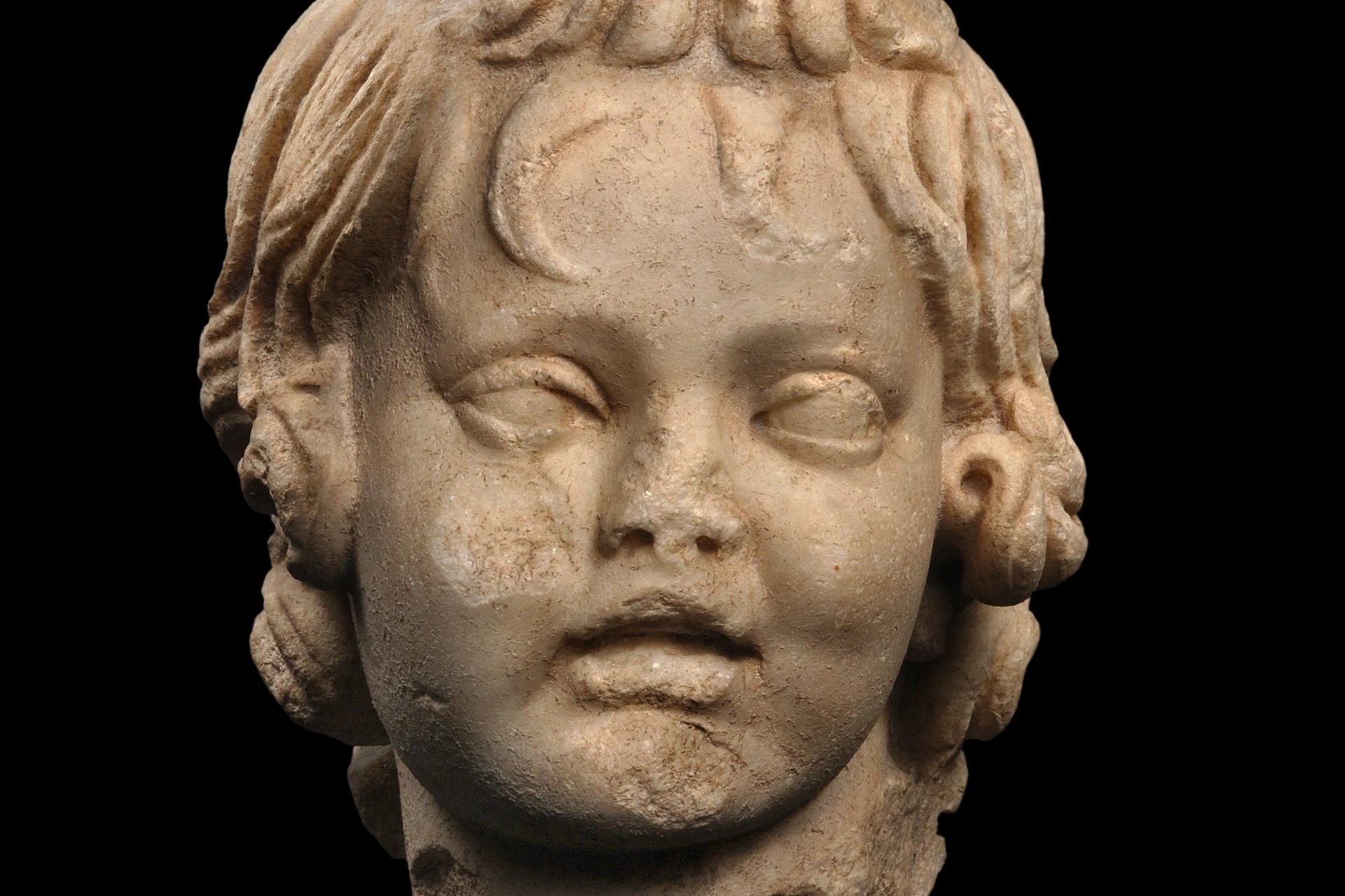 Photo: MUT | Peter Frankenstein, Hendrik Zwietasch Marble head of a boy with his hair falling into his forehead, looking at the viewer