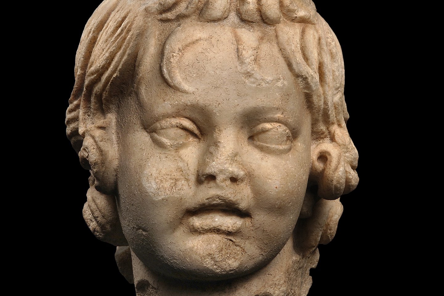 Photo: MUT | Peter Frankenstein, Hendrik Zwietasch Marble head of a boy with his hair falling into his forehead, looking at the viewer